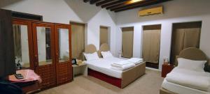 Ein Bett oder Betten in einem Zimmer der Unterkunft Hyba Heritage Guest House
