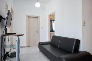TV a/nebo společenská místnost v ubytování Thea Apartment 3