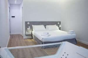 Ένα ή περισσότερα κρεβάτια σε δωμάτιο στο Central Promenade