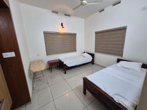 Ένα ή περισσότερα κρεβάτια σε δωμάτιο στο Zainab Apartment