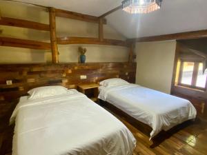 Voodi või voodid majutusasutuse Zhejiang Anji Xiaoshe B&B Near Zhejiang North Grand Canyon Deep Creek Canyon Rafting Jiangjunguan Rafting Wind Paragliding Zhangli Ancient Road Longwangshan Scenic Area toas