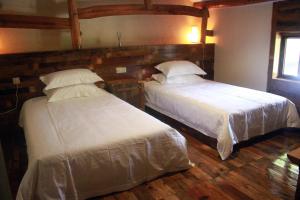 Voodi või voodid majutusasutuse Zhejiang Anji Xiaoshe B&B Near Zhejiang North Grand Canyon Deep Creek Canyon Rafting Jiangjunguan Rafting Wind Paragliding Zhangli Ancient Road Longwangshan Scenic Area toas