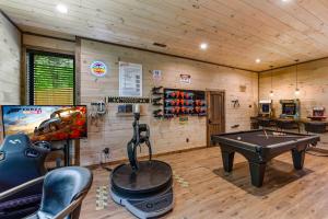 a game room with a ping pong table in a cabin at Dream Chaser - Adventure Gateway in Gatlinburg