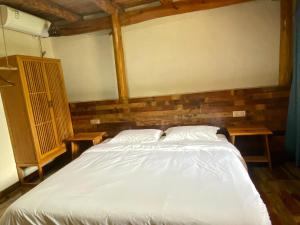 Voodi või voodid majutusasutuse Zhejiang Anji Xiaoshe B&B Near Zhejiang North Grand Canyon Deep Creek Canyon Rafting Jiangjunguan Rafting Wind Paragliding Zhangli Ancient Road Longwangshan Scenic Area toas