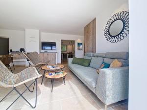 a living room with a couch and chairs at Villa tout équipée - Piscine & pool house - CLIM in Uzès