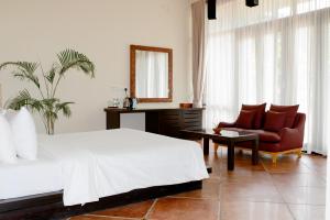 Postel nebo postele na pokoji v ubytování Celestia Ayurveda Resort