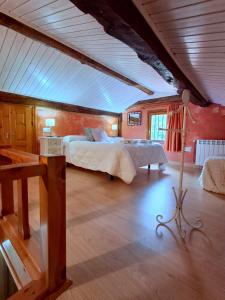 a bedroom with a large bed in a room at CASA TERESA in Camaleño