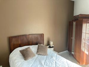 Voodi või voodid majutusasutuse Echoppe Ancienne Boutique de cordonnier avec jardin privé toas