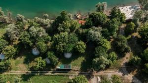 an overhead view of a house surrounded by trees at Glamping Riverside Skadar lake in Železnička Stanica Zeta