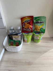 a refrigerator with some food and drinks in it at Pollux Habibie Deluxe Sea View By Superstay in Batam Center +9 photos