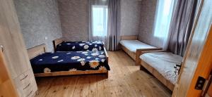 Postelja oz. postelje v sobi nastanitve Guest House Gvidani