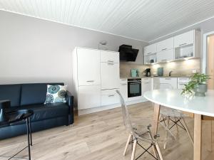 a living room with a couch and a table at Vörde Stadtidyll in Bremervörde