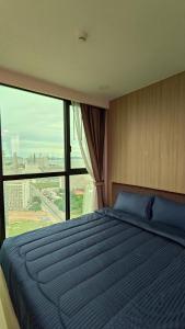 En eller flere senge i et værelse på Dusit Grand Condo View Jomtien By Snap Hosting + 25 billeder