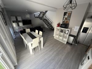 a kitchen and dining room with a table and chairs at Moradia t2 com Jacuzzi in Aldeia do Mato
