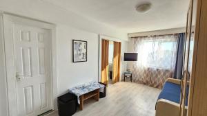 a room with a room with a door and a window at To the Nerversea beach! in Constanţa