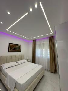 Giường trong phòng chung tại Gimi Apartments 4