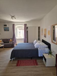 Postel nebo postele na pokoji v ubytování Apartments Tragurion