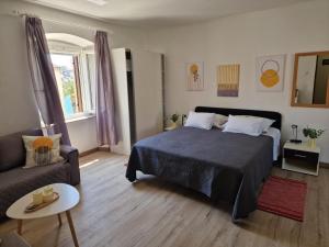 Postel nebo postele na pokoji v ubytování Apartments Tragurion