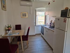 Kuchyň nebo kuchyňský kout v ubytování Apartments Tragurion