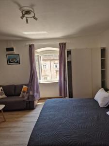 Postel nebo postele na pokoji v ubytování Apartments Tragurion