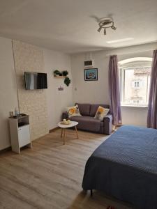 Postel nebo postele na pokoji v ubytování Apartments Tragurion