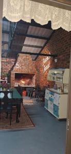 a room with a table and a brick wall at French Toast in George