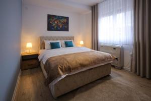 Giường trong phòng chung tại Apartmani Lepojevic