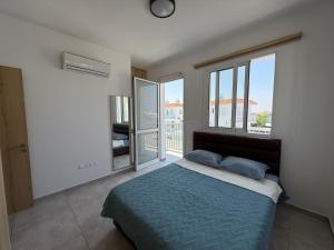 Ένα ή περισσότερα κρεβάτια σε δωμάτιο στο Sun & Sea House