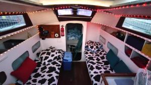 an image of an rv with two beds and lights at Voilier Bateau Rochefort in Rochefort