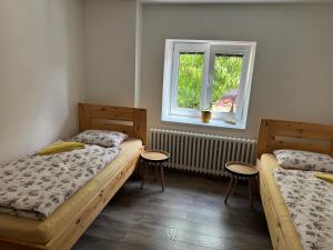 A bed or beds in a room at Četnická stanice Hluboká