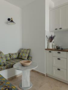 a living room with a table and a couch at VERANNA Patmos D4 in Patmos
