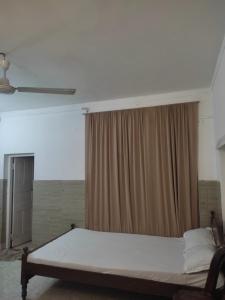 Postel nebo postele na pokoji v ubytování New Araliya Resort