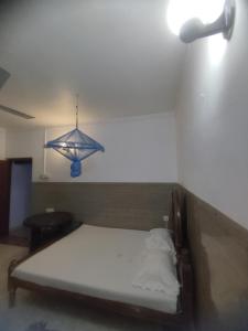 Postel nebo postele na pokoji v ubytování New Araliya Resort