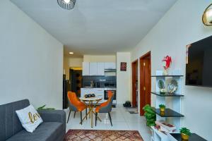 a living room with a couch and a table at 1 Bedroom Apartment in Syokimau near Airport and SGR in Nairobi
