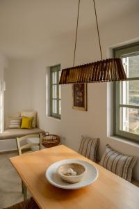 a dining room with a table with a plate on it at VERANNA Patmos D3 in Patmos +19 photos