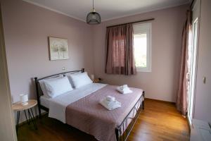 Ένα ή περισσότερα κρεβάτια σε δωμάτιο στο Lucky's House Chios