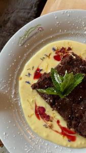 a white plate with a piece of food on it at Marktredwitzer Haus in Waldershof +42 photos