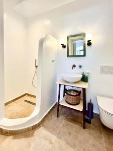 a bathroom with a sink and a toilet at VERANNA Patmos D3 in Patmos