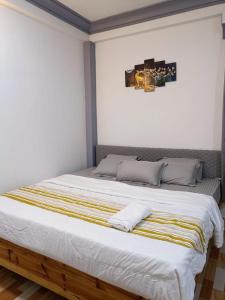 Postel nebo postele na pokoji v ubytování Nesting Abode Homestay
