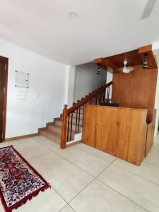 a room with stairs and a rug on the floor at Le Zaina's Fort Hotel in Cochin