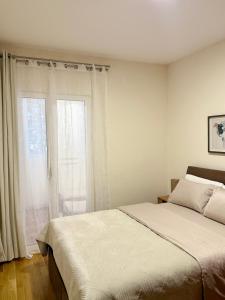Postel nebo postele na pokoji v ubytování Villa Perla Di Mare Budva