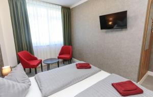 TV a/nebo společenská místnost v ubytování Second Home Hotel