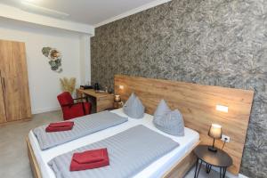 Postel nebo postele na pokoji v ubytování Second Home Hotel