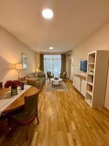a living room with a couch and a table at Hotel Villa Perla Di Mare in Budva