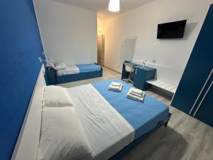 a bedroom with a bed with two towels on it at The Stars miaj in Campagna