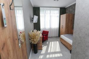 Postel nebo postele na pokoji v ubytování Second Home Hotel