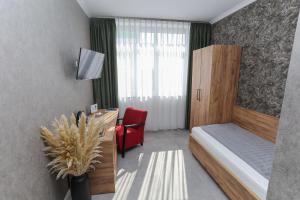 Postel nebo postele na pokoji v ubytování Second Home Hotel