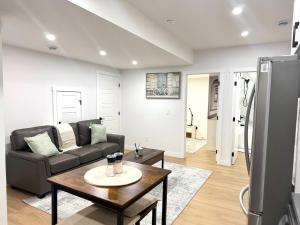 a living room with a couch and a table at Luxe Stay with a Designer Touch in Calgary
