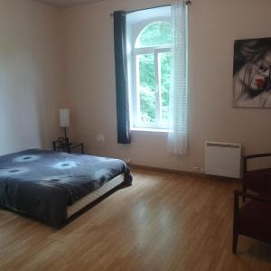 Postel nebo postele na pokoji v ubytování Appartement au cœur de la forêt