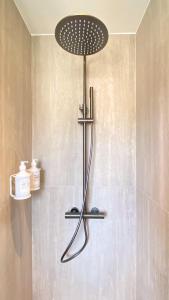 a shower with a shower head in a bathroom at Cannes Croisette in Cannes